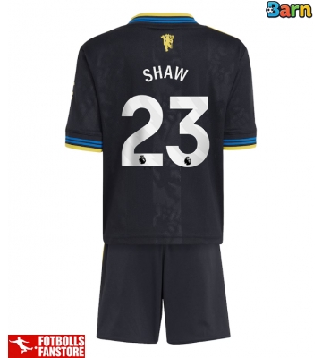 Manchester United Luke Shaw #23 Tredje Tröja Barn 2025-26 Kortärmad (+ Korta byxor)